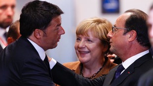 Italijanski premijer Mateo Renci, nemačka kancelarka Angela Merkel i francuski predsednik Fransoa Oland na vanrednom samitu Evropske unije, posvećenom rešavanju izbegličke krize